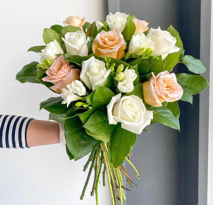 Florette BRUSSELS - A lovely peach & white bouquet that has gorgeous roses, fragrant freesias, and lemon leaves.