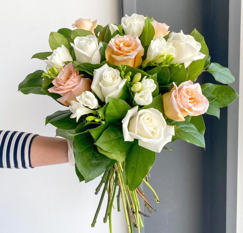 Florette BRUSSELS - A lovely peach & white bouquet that has gorgeous roses, fragrant freesias, and lemon leaves.